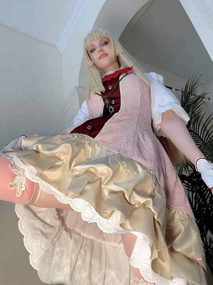 1girl animated animated_gif blonde_hair blunt_bangs blunt_sidelocks brooch buttons clothes_lift clothing_cutout cosplay dress dress_lift emilie_de_rochefort emilie_de_rochefort_(cosplay) female_focus fingerless_gloves frilled_dress frilled_panties frilled_sleeves frills gloves heart_cutout hime_cut indoors jewelry lace_trim long_hair looking_at_viewer looking_down makeup nail_polish namco neck_ruff necklace panties peppy_cos pink_thighhighs puffy_short_sleeves puffy_sleeves real_life ribbon-trimmed_legwear ribbon_trim see-through_clothes see-through_panties short_dress short_sleeves sidelocks solo tekken tekken_8 thighhighs underwear white_gloves white_panties