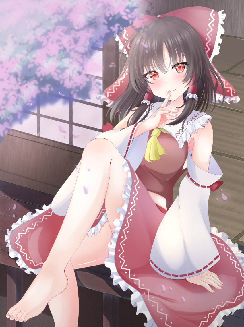 1girl ascot barefoot blush bow brown_hair cherry_blossoms closed_mouth commentary_request detached_sleeves falling_petals finger_to_mouth frilled_bow frilled_hair_tubes frilled_skirt frills hair_bow hair_tubes hakurei_reimu highres long_hair looking_at_viewer petals pink_petals red_bow red_eyes red_skirt ribbon-trimmed_sleeves ribbon_trim ringo002 shushing sitting skirt skirt_set solo toes touhou yellow_ascot
