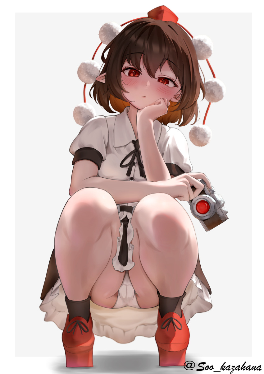 1girl absurdres black_ribbon black_socks blush brown_hair camera closed_mouth collared_shirt commentary frilled_skirt frills geta hat highres holding holding_camera looking_at_viewer neck_ribbon panties pantyshot pointy_ears pom_pom_(clothes) puffy_short_sleeves puffy_sleeves red_eyes red_hat red_shoes ribbon shameimaru_aya shirt shoes short_sleeves skirt socks solo soo_kazahana squatting tengu-geta tokin_hat touhou twitter_username underwear white_panties white_shirt