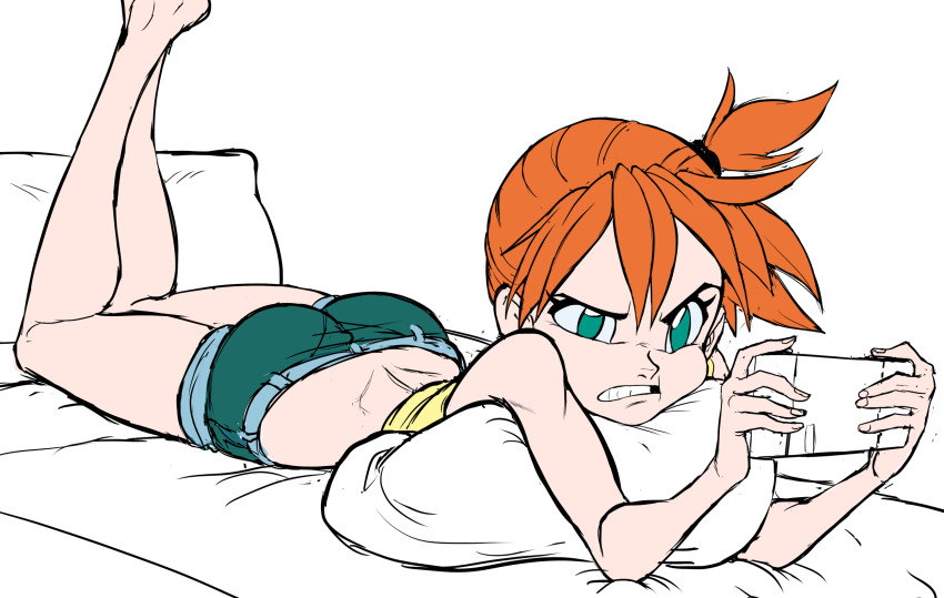 ass bare_back frustrated green_eyes highres hugging_object lying misty_(pokemon) nintendo nintendo_switch on_bed on_stomach pillow pillow_hug playing_games pokemon pokemon_(anime) pokemon_(classic_anime) red_hair short_shorts shorts side_ponytail tank_top teevo thighs tomboy